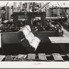 Loading cotton into hold of ship. Port of Houston, Texas