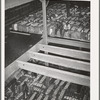 Storing bales of cotton into hold of freighter for export. Notice the different levels. Port of Houston, Texas