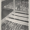Storing bales of cotton into hold of freighter for export. Notice the different levels. Port of Houston, Texas