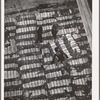 Storing bales of cotton into hold of freighter for export. Notice the different levels. Port of Houston, Texas