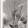 Loading of cotton for export. Notice man operating winch. Port of Houston, Texas