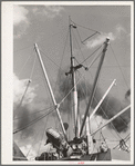 Loading of cotton for export. Notice man operating winch. Port of Houston, Texas