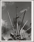 Loading of cotton for export. Notice man operating winch. Port of Houston, Texas