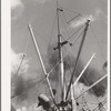 Loading of cotton for export. Notice man operating winch. Port of Houston, Texas