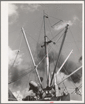 Loading of cotton for export. Notice man operating winch. Port of Houston, Texas