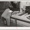 Looking at an exhibit of needle work at Gonzales, Texas, county fair