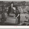 Packing exhibits to be returned to their owners during the closing hours of the fair. Gonzales, Texas