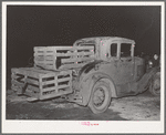 Farmer's automobile with boxes of turkeys on it at cooperative poultry warehouse. Brownwood, Texas