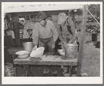 Cowboys of the SMS Ranch washing up for dinner. Ranch near Spur, Texas