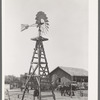 Windmill, watering trough and barn on SMS Ranch near Spur, Texas
