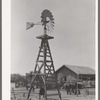 Windmill, watering trough and barn on SMS Ranch near Spur, Texas