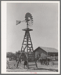 Windmill, watering trough and barn on SMS Ranch near Spur, Texas