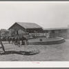 Watering trough, barns and corral on SMS Ranch near Spur, Texas