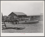 Watering trough, barns and corral on SMS Ranch near Spur, Texas