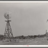 Windmill and watering trough on SMS Ranch near Spur, Texas