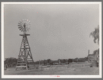 Windmill and watering trough on SMS Ranch near Spur, Texas