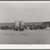 Tractors clustered around gasoline tanks on 4900 acre farm near Ralls, Texas