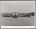 Tractors clustered around gasoline tanks on 4900 acre farm near Ralls, Texas