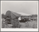 Chuck wagon and tarpaulin. Ranch near Spur, Texas