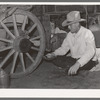 Cowboy eating dinner by the chuck wagon on SMS Ranch near Spur