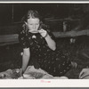 Migrant woman drinking coffee from saucer while camped near Prague, Oklahoma