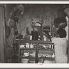 Kitchen cabinet in the home of Negro agricultural day laborer. Muskogee, Oklahoma. Note lunch pail