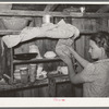 Kitchen cabinet in the house of agricultural day laborer living near Webbers Falls, Oklahoma. This was the only food in the house. The father had always been a day laborer; the two children have never attended school. Muskogee County, Oklahoma