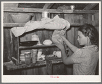 Kitchen cabinet in the house of agricultural day laborer living near Webbers Falls, Oklahoma. This was the only food in the house. The father had always been a day laborer; the two children have never attended school. Muskogee County, Oklahoma