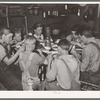 A family of agricultural day laborers eating dinner after a morning spent in chopping cotton. Though the fare of these people consist of the inexpensive and heavy starches, it is usually well prepared