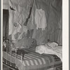 Bedroom of tenant farmer living near Warner, Oklahoma. Notice American flag quilt