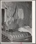 Bedroom of tenant farmer living near Warner, Oklahoma. Notice American flag quilt
