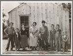 Family of agricultural day laborer, former oil worker and coal miner. The family lives in this two-room shack in McIntosh County, Oklahoma