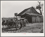 The tractor and home of a man who at one time was a tenant farmer but who is now a day laborer. Wagoner County, Oklahoma