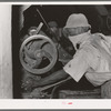 Negro working on machine in cotton seed oil mill. McLennan County, Texas