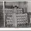 Piling picked turkeys on racks. Cooperative poultry house, Brownwood, Texas