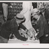 Packing picked turkeys in boxes at cold storage plant. Brownwood, Texas