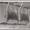 Type of drop gate for loading of cotton seed hulls onto trucks. Cotton seed oil mill. McLennan County, Texas