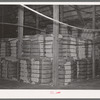 Baled cotton at cotton seed oil plant. McLennan County, Texas