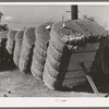 Bales of cotton in gin yard. West, Texas
