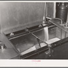 Milk flowing into pasteurizer. Creamery, San Angelo, Texas