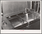 Milk flowing into pasteurizer. Creamery, San Angelo, Texas