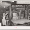 Lifting boxes of supplies by means of elevator. Wholesale grocery, San Angelo, Texas