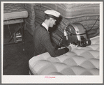 Forming a roll edge on innerspring mattress by special machine. Mattress factory. San Angelo, Texas