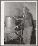 Farmer steaming his milk cans before taking them home. Creamery, San Angelo, Texas