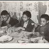 Children of Pomp Hall, Negro tenant farmer, eating their supper. For supper the family had corn bread, peas, gravy, rice, fried bacon and turnips. See general caption number 23. Creek County, Oklahoma