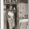 Pomp Hall, Negro tenant farmer, coming in the kitchen door carrying seed and groceries which he bought in Tulsa. Creek County, Oklahoma. See general caption number 23