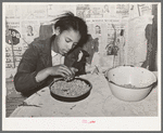 Daughter of Pomp Hall, Negro tenant farmer, picking peas for supper. Creek County, Oklahoma. See general caption number 23