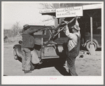 Pomp Hall, Negro tenant farmer, and blacksmith loading Pomp's plow into truck after it has been sharpened. Depew, Oklahoma. See general caption number 23