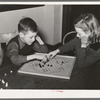 Boy and girl playing Chinese checkers. Eufaula, Oklahoma