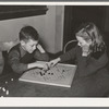 Boy and girl playing Chinese checkers. Eufaula, Oklahoma